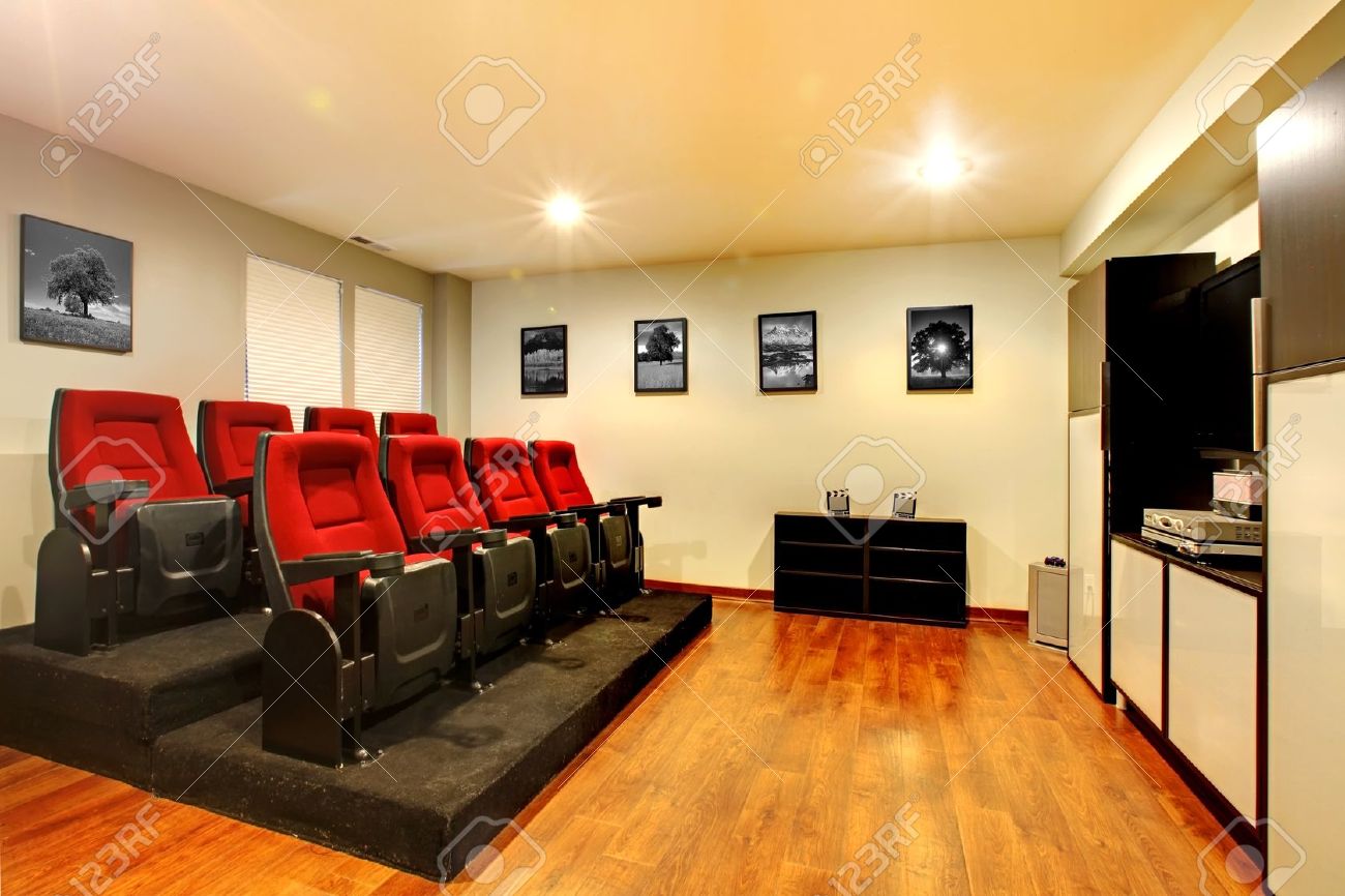 12621225-Home-TV-movie-theater-entertainment-room-interior-with-real-cinema-chairs--Stock-Photo.jpg