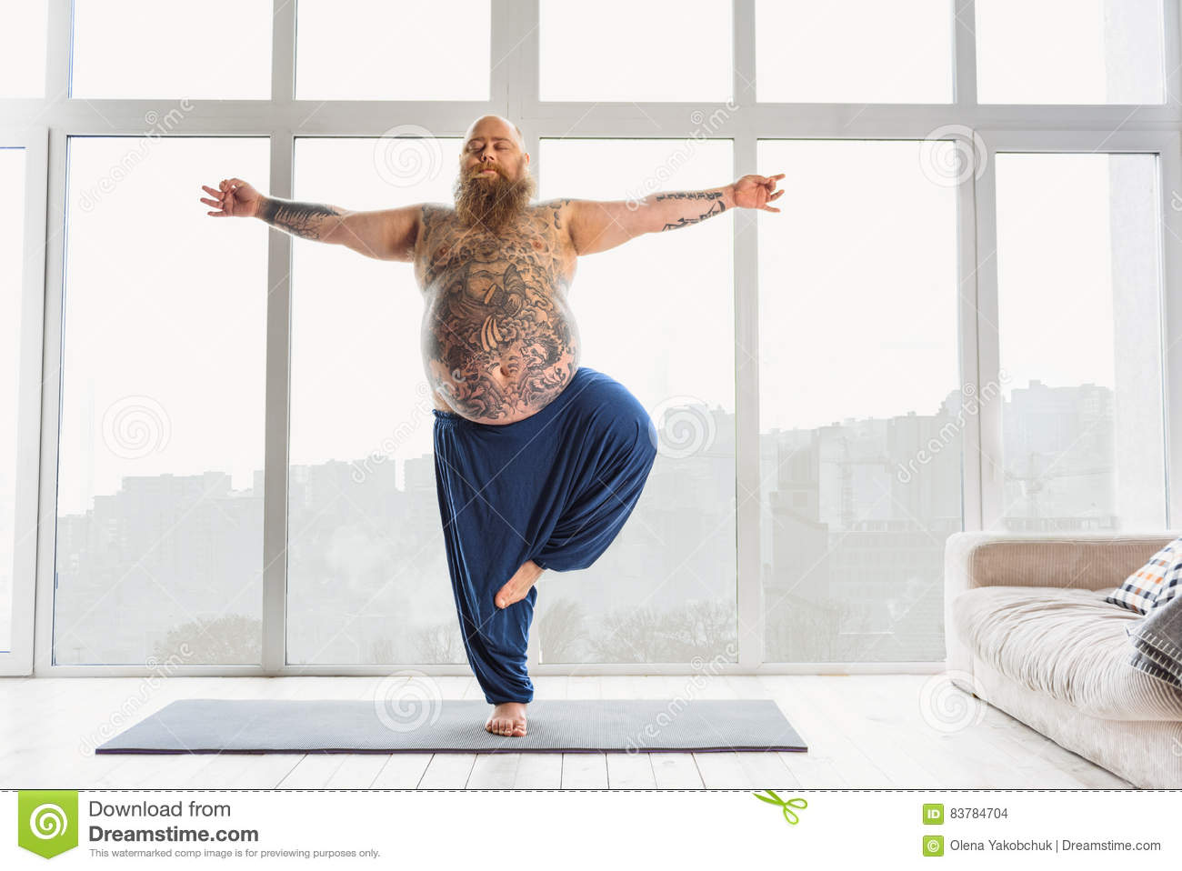 calm-fat-man-relaxing-me-leg-stretching-83784704.jpg