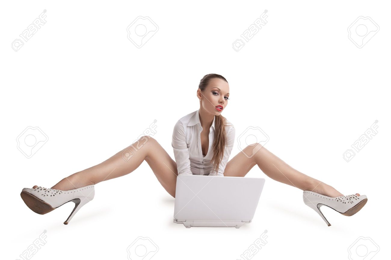 11791429-sexy-young-woman-sit-with-laptop-and-beauty-long-legs.jpg