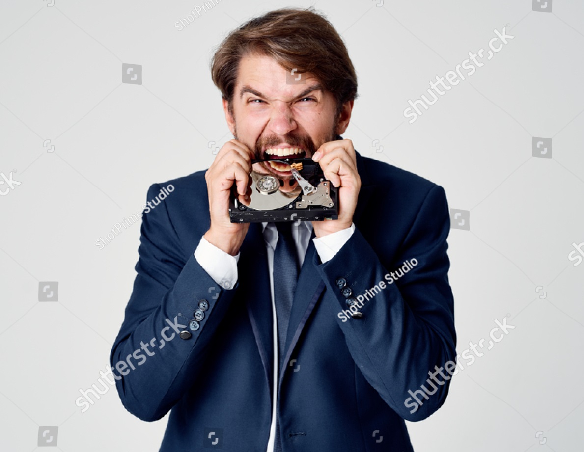 stock-photo-aggressive-man-chewing-hard-drive-1193254606.jpg