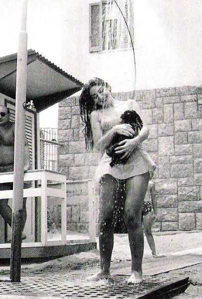 Maria Callas taking a shower with her dog.jpg